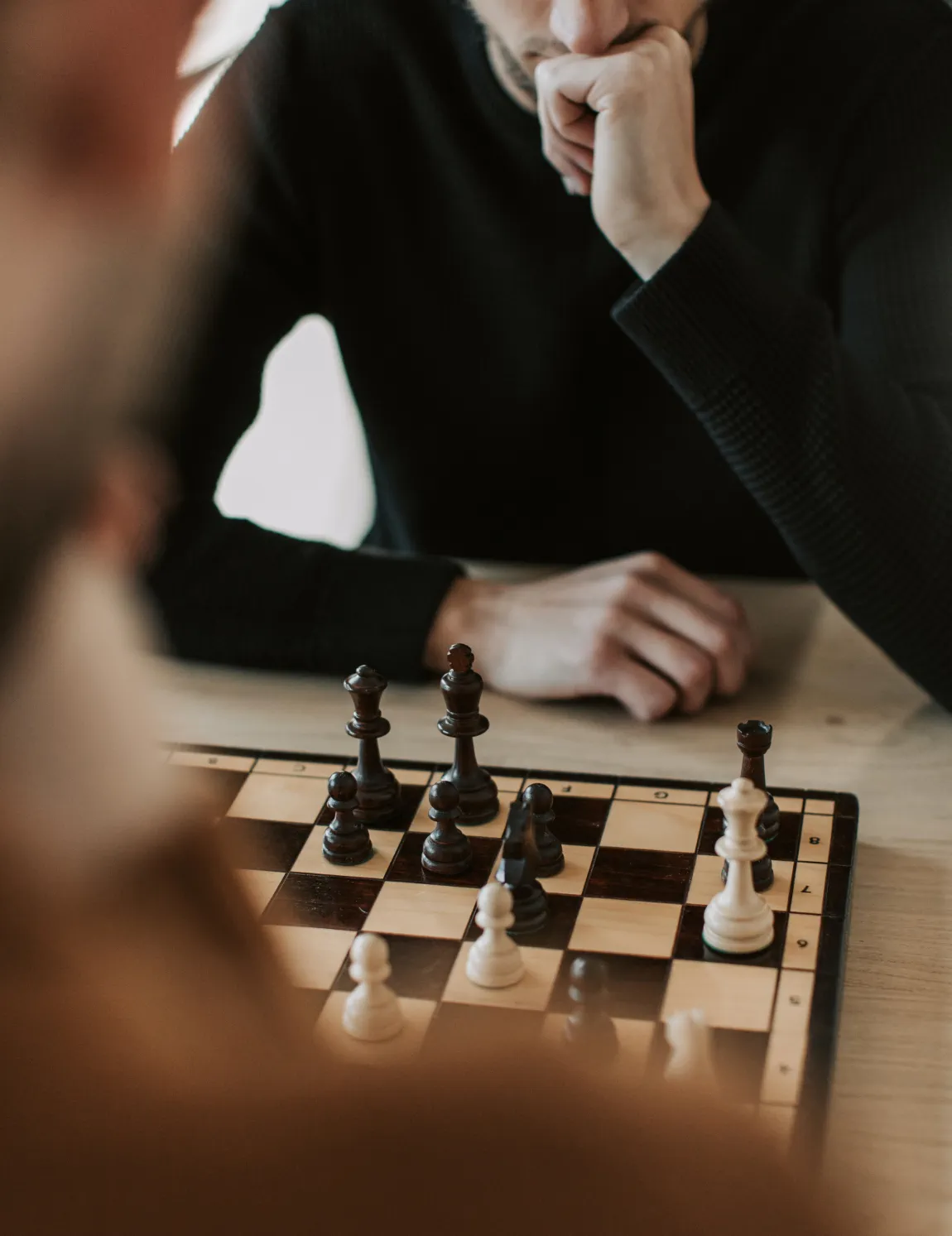 Man plays chess.